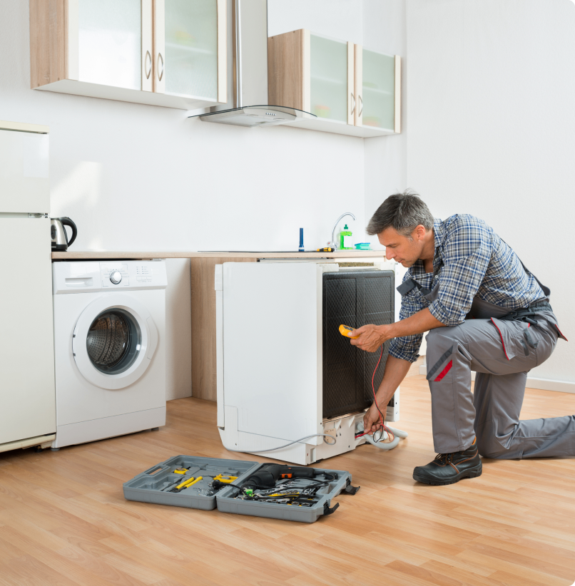 h1 02 Technician repairing kitchen appliance with tools.