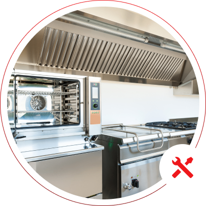 Commercial kitchen with stainless steel appliances.