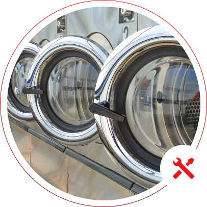 h2 06 Laundromat dryers with maintenance icon overlay.
